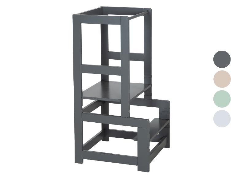 Grauer Lernturm mit verstellbarer Höhe und vier Farbmustern.