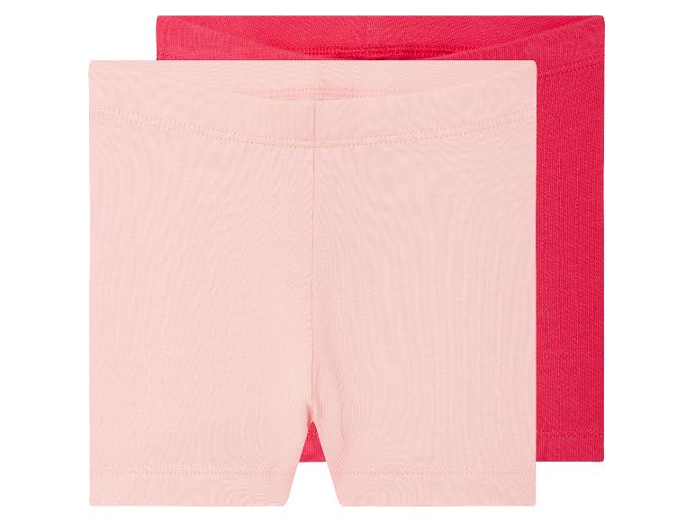 Zwei Shorts für Mädchen, rosa und rot.