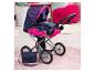Puppenwagen mit marineblauem und pinkem Herzmuster und passender Tasche.