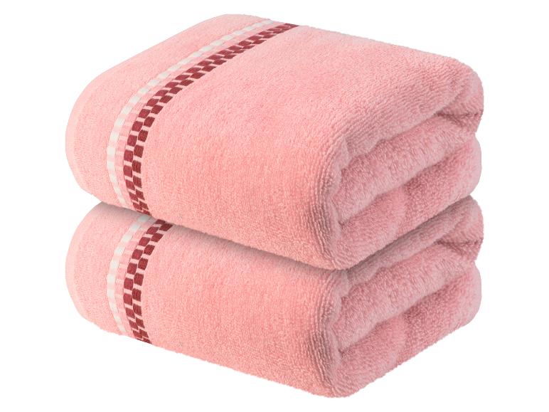 Zwei rosa Handtücher mit einem rot-weißen Rand.
