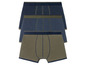Drei Paar Boxershorts in dunkelblau und grün.