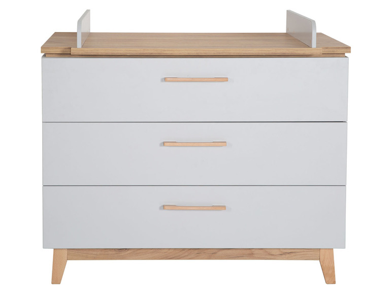 Eine graue Wickelkommode mit drei Schubladen und einer Wickelauflage.