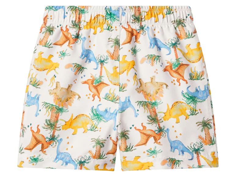 Weiße Badeshorts mit farbenfrohem Dinosaurier- und Palmenmuster.