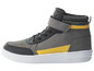 Graue Sneaker mit gelben Akzenten und Klettverschluss.