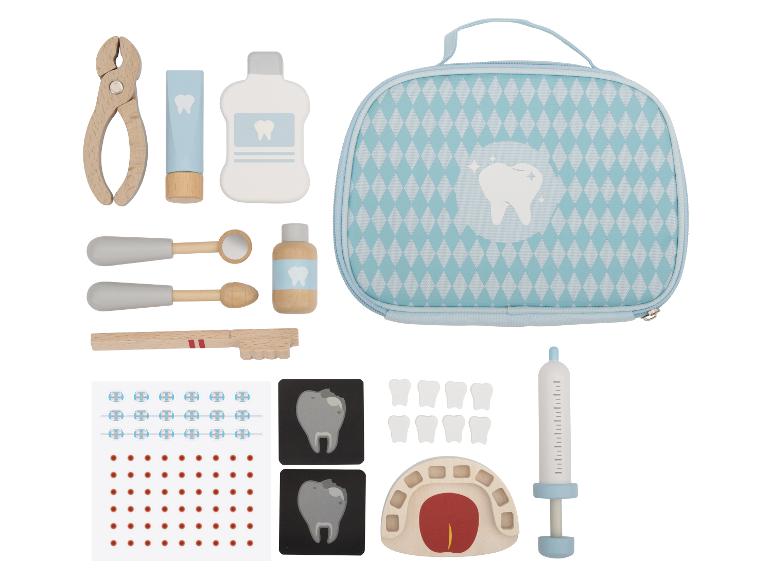 Ein hölzernes Zahnarzt-Spielset mit verschiedenen Werkzeugen, einem Zahnmodell und einer Tragetasche.