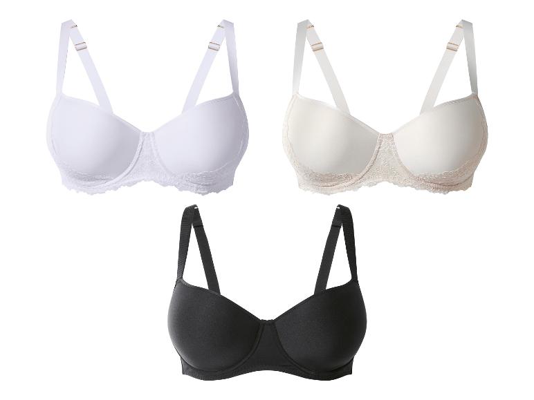 Drei BHs in Weiß, Beige und Schwarz, mit verstellbaren Trägern und Spitzendetails.