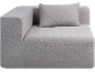Hellgraues Eckmodulsofa mit passendem Kissen.