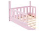 Rosa Kinderbett mit Gitter und Lattenrost.