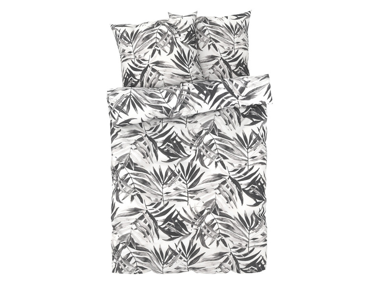 Bettwäsche mit tropischem Blättermuster.