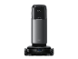Schwarzer Saugroboter mit selbstentleerender Station, mit dem Text „UNICLEAN STATION“.