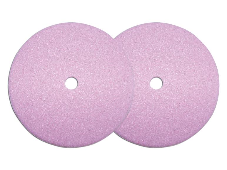 Zwei rosa Schleifscheiben mit einem Loch in der Mitte.