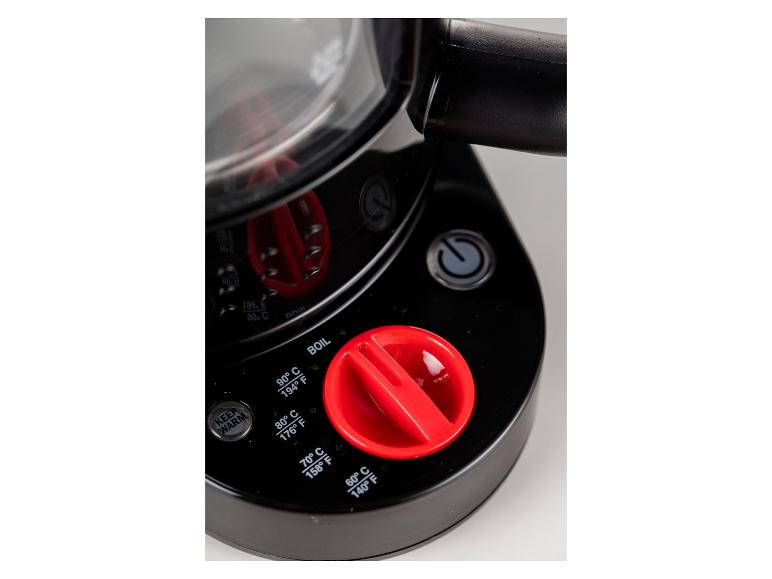 Nahaufnahme eines schwarzen Wasserkochers mit rotem Temperaturregler und verschiedenen Temperatureinstellungen.