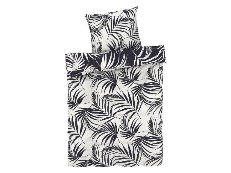 Ein Bettbezug mit tropischem Palmenblatt-Muster.