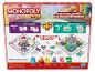 Monopoly Junior mit doppelseitigem Spielplan und Figuren von Pinguin, Auto, Quietscheente, Hund, Katze und Dino.