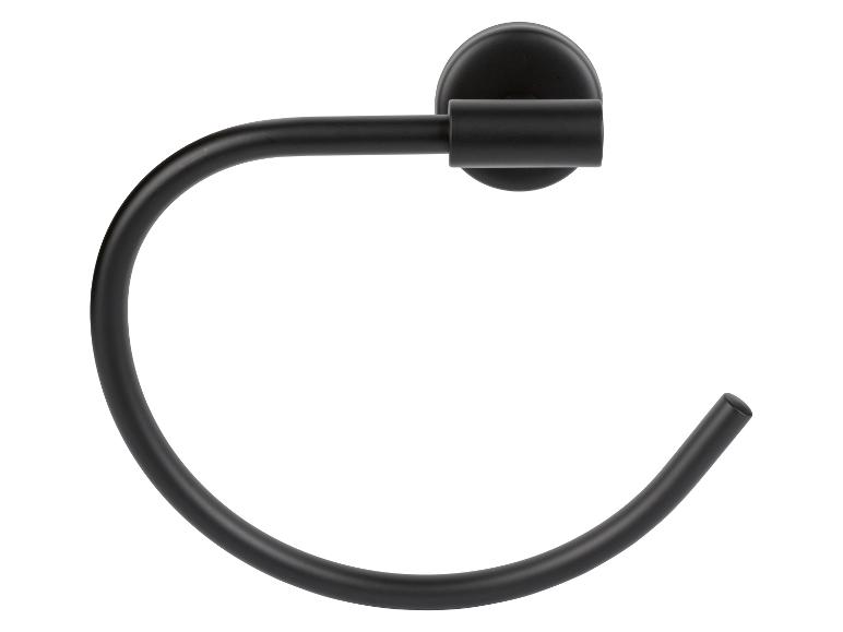 Ein schwarzer, ringförmiger Handtuchhalter an der Wand montiert.