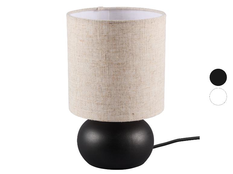 Tischlampe mit beigem Stoffschirm und schwarzem Fuß, mit Farboptionen.