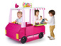 Kinder spielen mit einem rosafarbenen Feber Food Truck Spielzeug