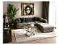 Modernes Wohnzimmer mit grauem Ecksofa, Glastisch und Wandkunstgemälde.