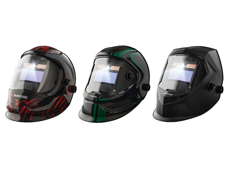 Drei Parkside Schweißmasken: eine mit roten Flammen, eine mit grünen Streifen und eine schwarze.