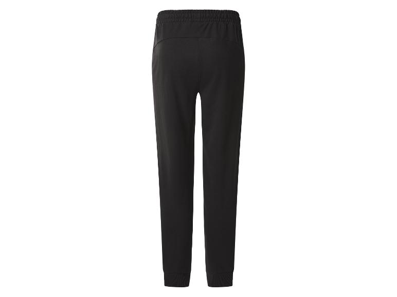 Schwarze Jogginghose mit elastischem Bund und gerippten Bündchen, Rückansicht.