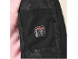 Innenseite einer schwarzen Jacke mit Thermometer-Etikett