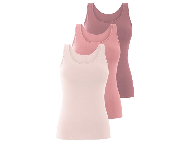 Drei schlichte, rosafarbene Tanktops.