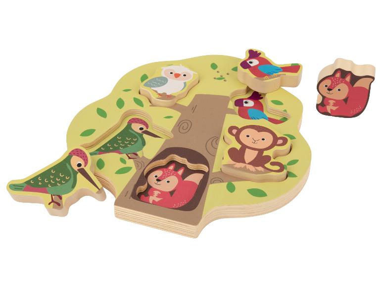 Holzbaumförmiges Puzzle mit Tierfiguren, darunter Fuchs, Eule, Vögel und Affe.
