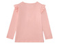 Rosa Langarmshirt mit Rüschen für Mädchen.
