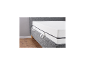 LIVARNO 7-Zonen-Hybridschaummatratze Comfort Plus auf einem grauen Bettgestell