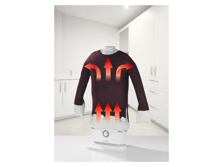 Automatischer Kleiderdampfer mit Pullover, rote Pfeile zeigen die Dampfrichtung an.