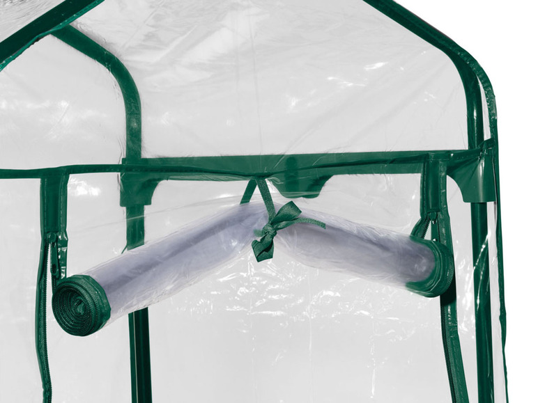 Grünes Mini-Gewächshaus mit transparentem Dach und Wänden.