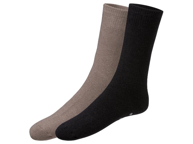 Ein Paar Socken: schwarz und beige.