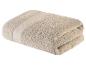 Weiches, beige Badetuch.