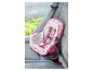 Ein rosa Baby Born Autositz mit einem niedlichen Muster.