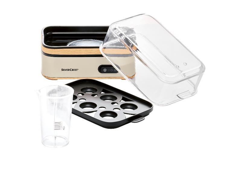 SilverCrest Eierkocher: Gerät, transparenter Deckel und Eierhalter.