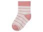 Eine rosafarbene Socke mit weißen Streifen.