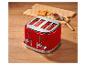Roter Toaster, Toast und Marmelade auf einem Holztisch.