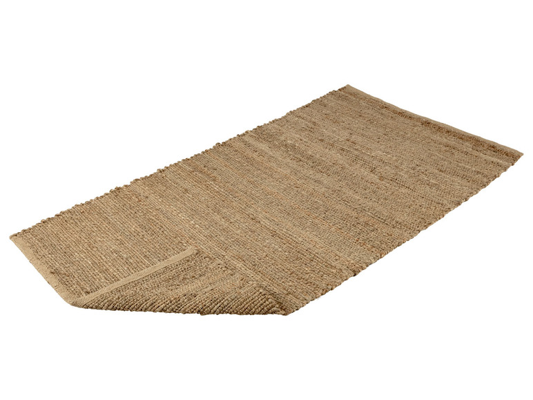 Ein natürlicher Jute-Teppich in einem hellbraunen Farbton.
