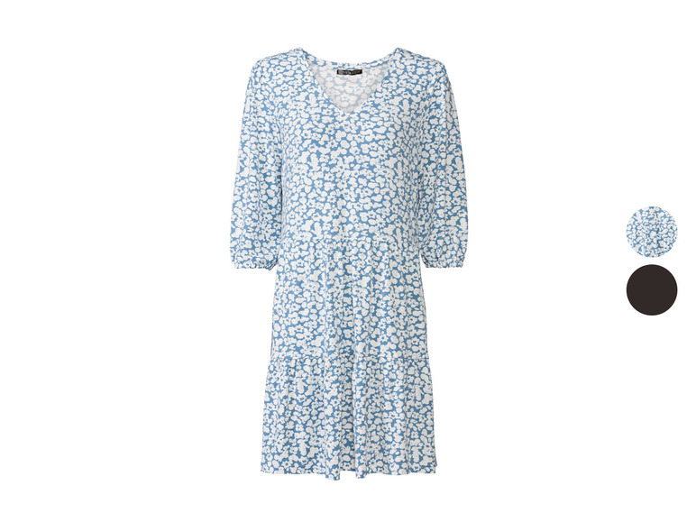 Ein blaues Kleid mit weißem Blumenmuster