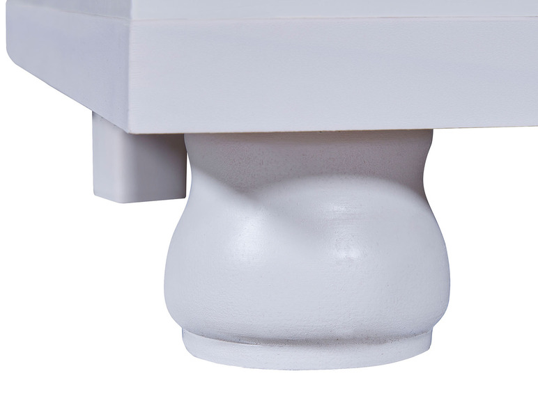 Weißer Holztischfuß mit abgerundeten Ecken.