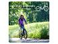 Frau auf einem E-Bike, mit Text, der bis zu 130 km Reichweite pro Akkuladung angibt.