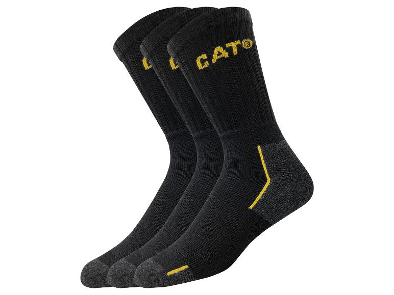 Drei Paar schwarze CAT®-Socken mit gelben Details.