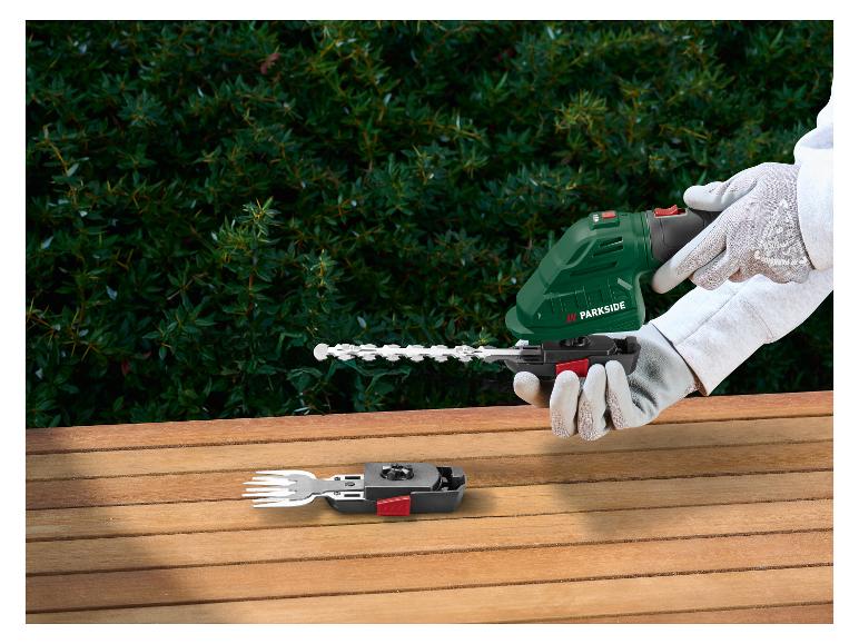 Akku-Heckenschere mit Gabelaufsatz auf einem Holztisch