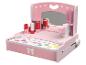 Ein rosa Holz-Schminktisch für Kinder mit Spiegel, Lippenstiften und Kosmetik.