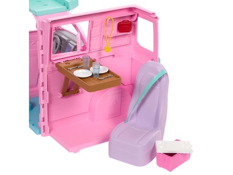 Rosa Spielzeug-Wohnmobil mit Esstisch, Sitz und Zubehör.