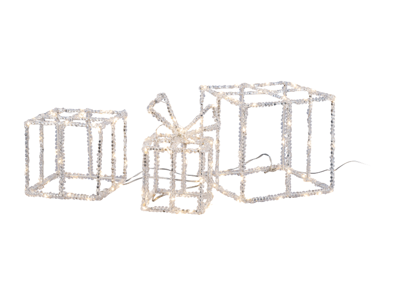 Drei beleuchtete Geschenkboxen mit Schleife, aus transparenten Materialien mit Eiseffekt.