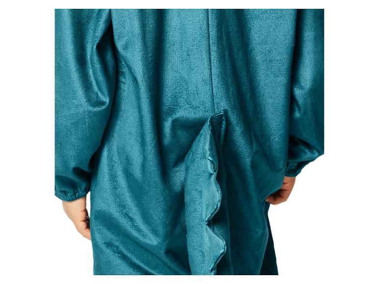 Ein türkisfarbenes Dinosaurierkostüm mit einem Schwanz.