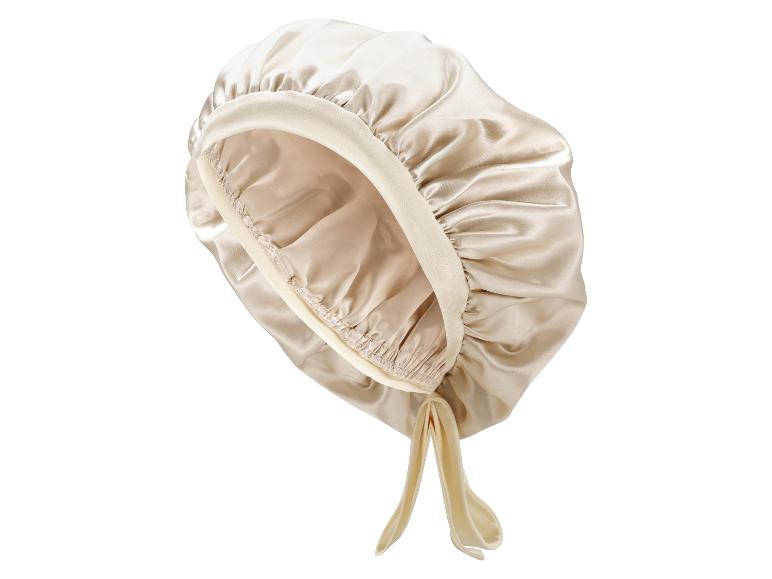 Champagnerfarbene Satin-Haube mit gerafftem Rand und Bändern.