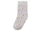 Graue Socke mit bunten Punkten.
