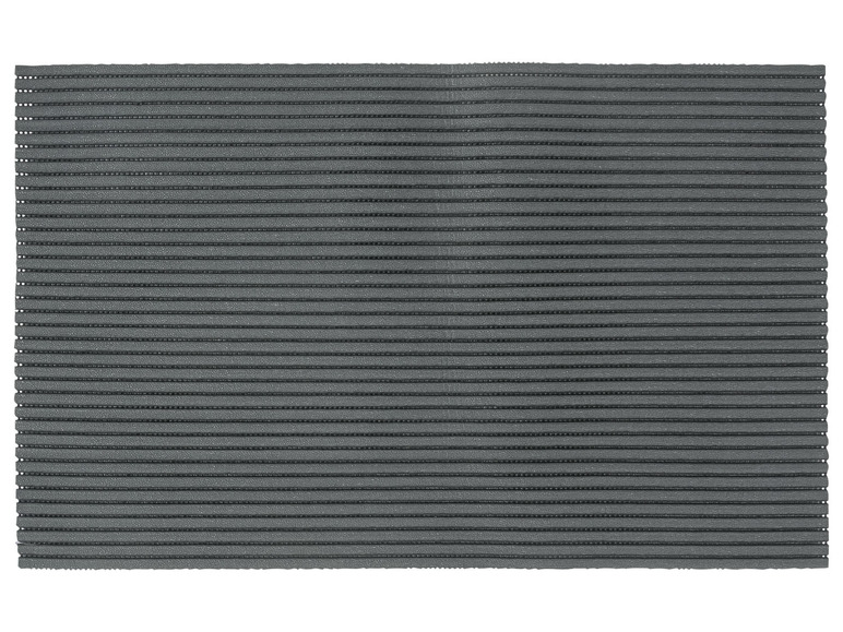 Eine graue Fußmatte mit geriffelter Oberfläche.